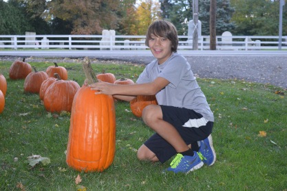 Shane selecting his carving pumpkin @ Stand Against Cancer!
